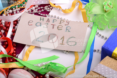 Image of Easter background with eggs, ribbons and spring decoration