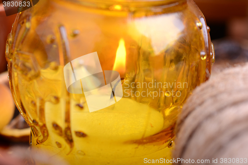 Image of candles in glass burning romantic celecration concept wooden kitchen close up