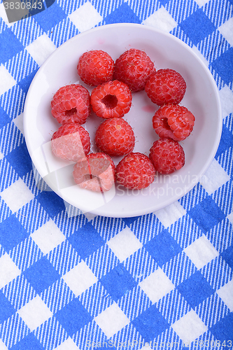Image of Big Pile of Fresh Raspberries in the White Bowl