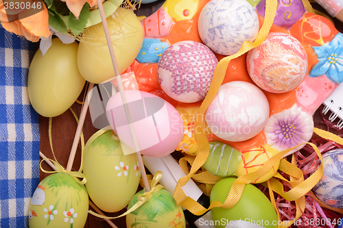 Image of Easter background with eggs, ribbons and spring decoration