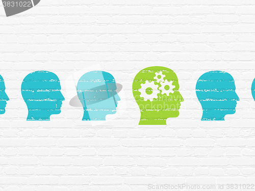 Image of Finance concept: head with gears icon on wall background