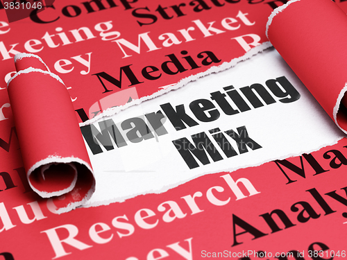 Image of Advertising concept: black text Marketing Mix under the piece of  torn paper