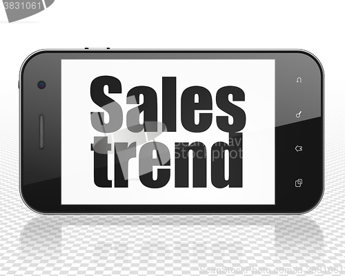Image of Advertising concept: Smartphone with Sales Trend on display