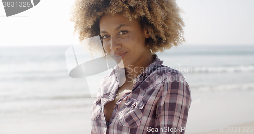 Image of Woman Smiling At Camera On The Beach
