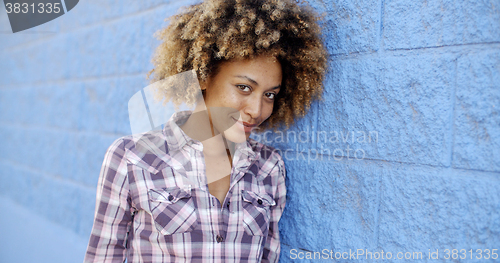 Image of Black Woman Leaning Against Wall