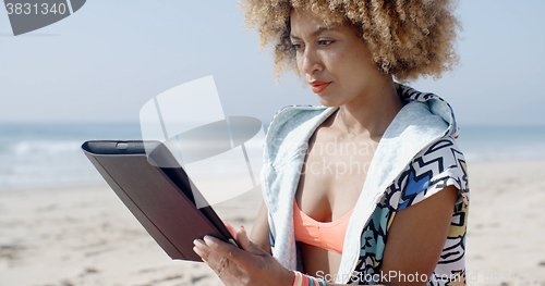 Image of African American Girl Using Tablet Pc At Beach