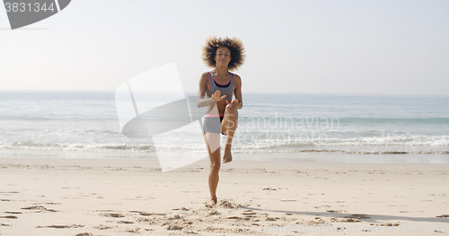 Image of Young Sport Woman On The Beach