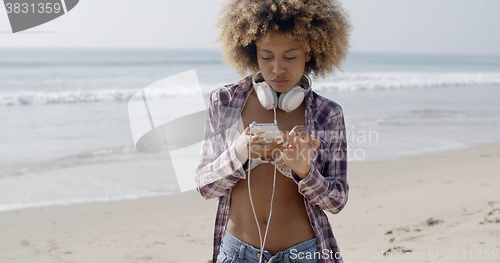 Image of Woman Texting Sms On The Beach