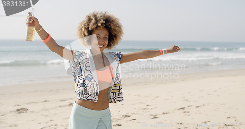 Image of Happy Girl Relaxing On The Beach