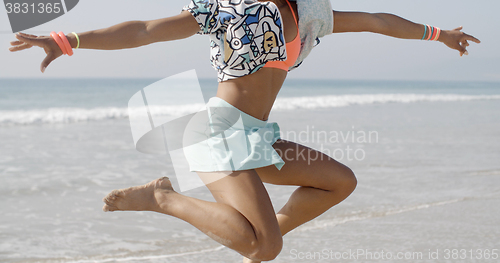 Image of Woman Dancing Against The Sea