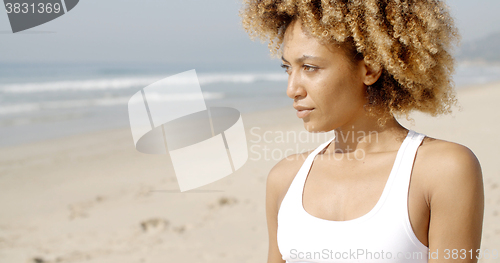 Image of Young Woman Enjoying Sunlight.