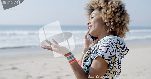 Image of Happy Woman Talking On Mobile Phone