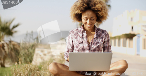 Image of Girl Working With A Laptop Outdoors