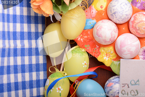 Image of Happy Easter invitation card, hand made eggs at a gift box