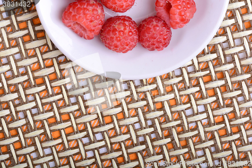 Image of Big Pile of Fresh Raspberries in the White Bowl