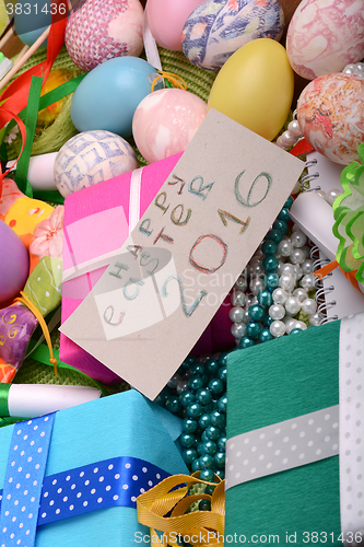 Image of easter eggs with flowers and gift box 