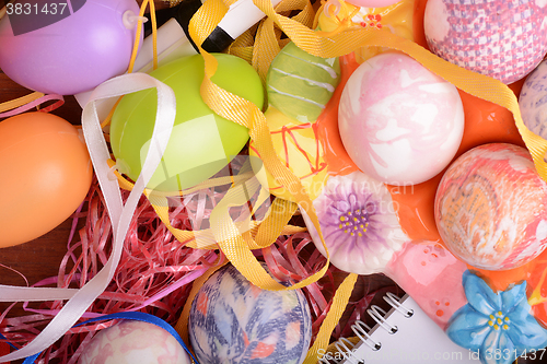 Image of Easter background with eggs, ribbons and spring decoration