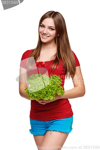 Image of Happy woman with lettuce