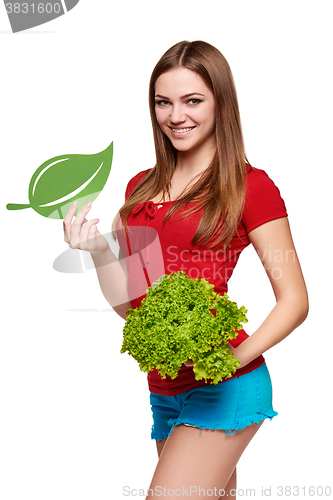 Image of Happy woman with lettuce