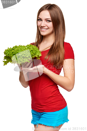 Image of Happy woman with lettuce