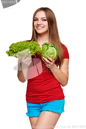 Image of Happy woman with lettuce