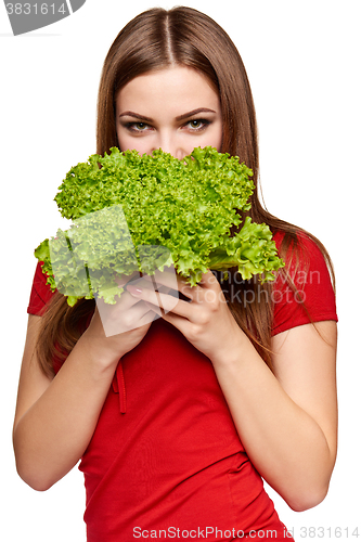 Image of Happy woman with lettuce