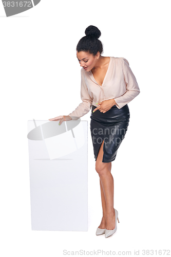 Image of Smiling businesswoman with banner