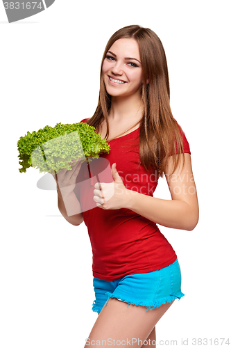 Image of Happy woman with lettuce