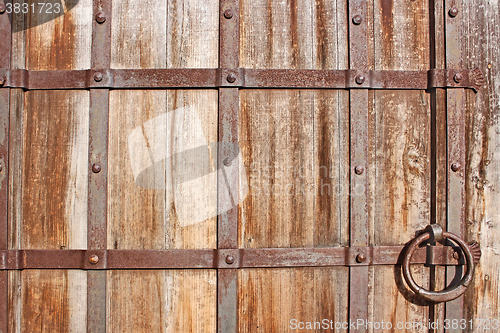 Image of Restoring medieval wooden gate