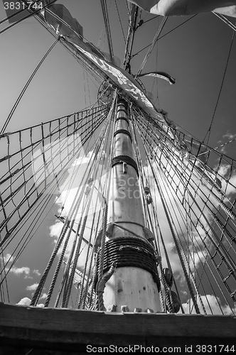 Image of Mast with sails of an old sailing vessel, black and white photo
