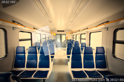Image of Rows of seats in a passenger train carriage