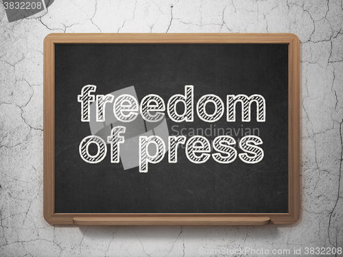 Image of Political concept: Freedom Of Press on chalkboard background