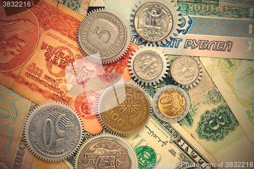 Image of Coins gearweels on the money background