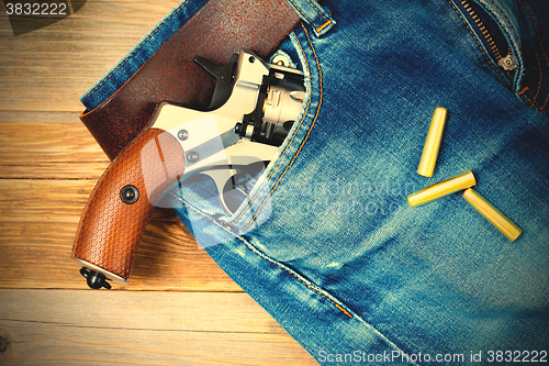 Image of revolver in the pocket