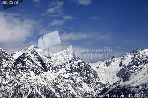 Image of Snowy rocks  at sunny day