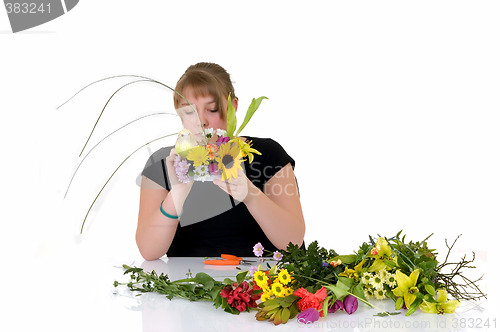 Image of Young girl arranging flowers