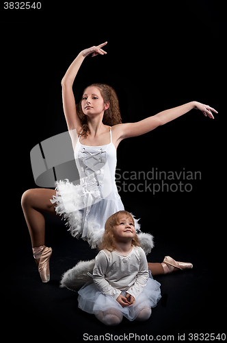 Image of Young pretty ballerina with her daughter