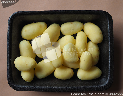 Image of Potato vegetables in a tub