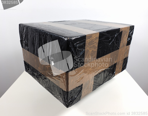 Image of Black packet parcel