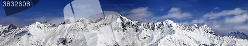 Image of Large panoramic view on snowy mountains in sunny day