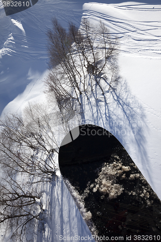 Image of Snowboard over off-piste slope