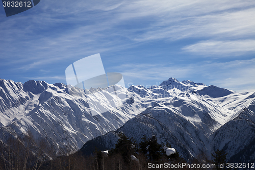 Image of Sunlight snowy mountains in wind day