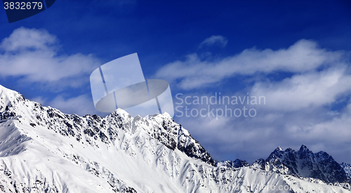 Image of Panoramic view on snowy mountains at sun day