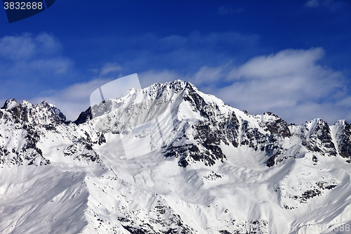 Image of Snowy mountains at sun day