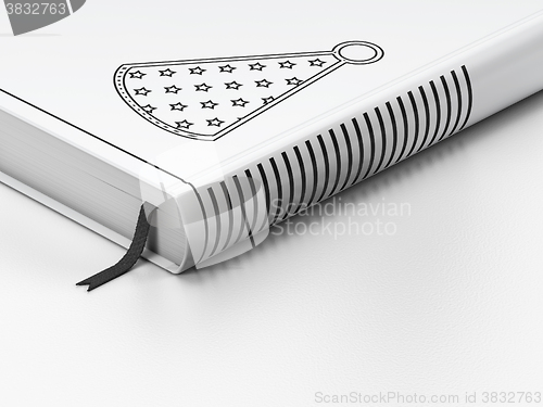 Image of Holiday concept: closed book, Party Hat on white background