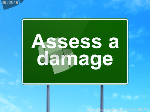 Image of Insurance concept: Assess A Damage on road sign background
