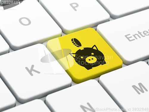 Image of Money concept: Money Box With Coin on computer keyboard background