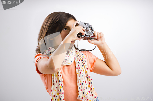 Image of Little girl taking a photo