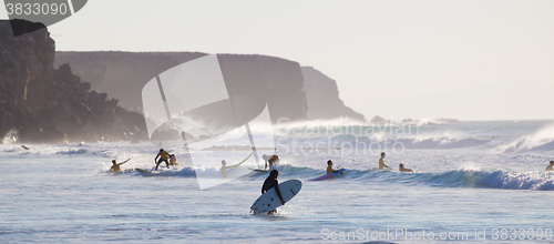 Image of Surfers surfing on El Cotillo beach, Fuerteventura, Canary Islands, Spain.