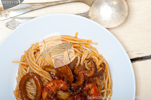 Image of Italian seafood spaghetti pasta on red tomato sauce 